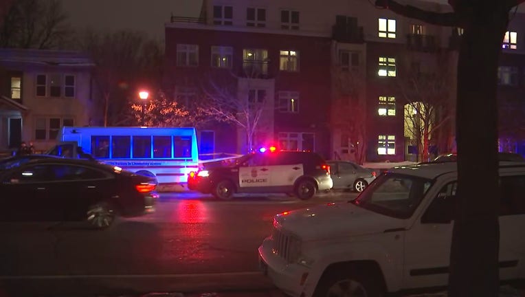 Police investigate a homicide at this apartment building