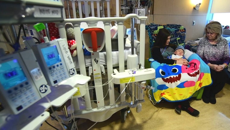 Boy and family in hospital room