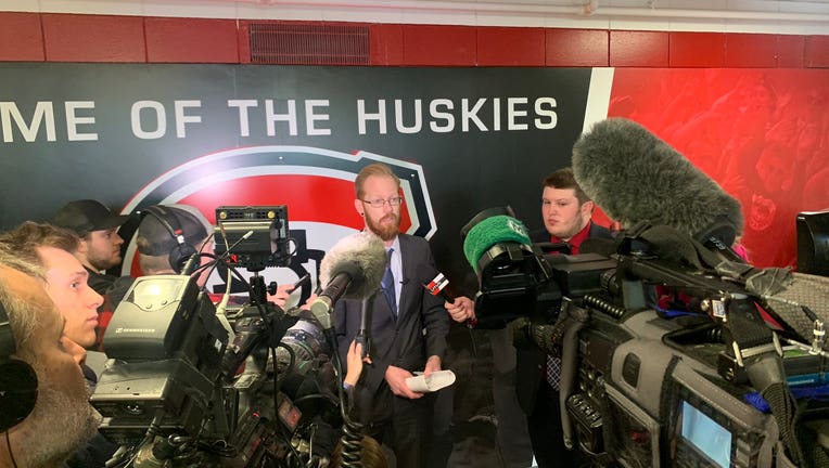 Scrum of reporters around St. Cloud State officials