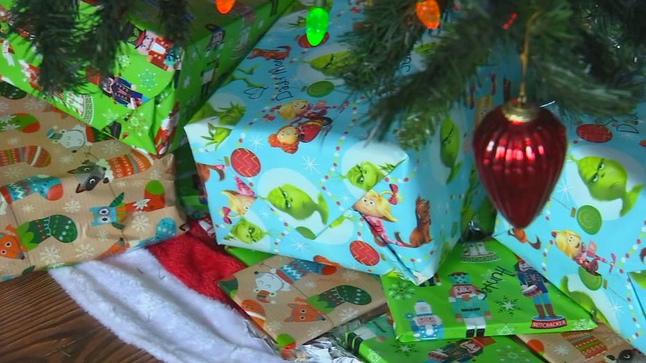Christmas gifts wrapped neatly under a tree. 