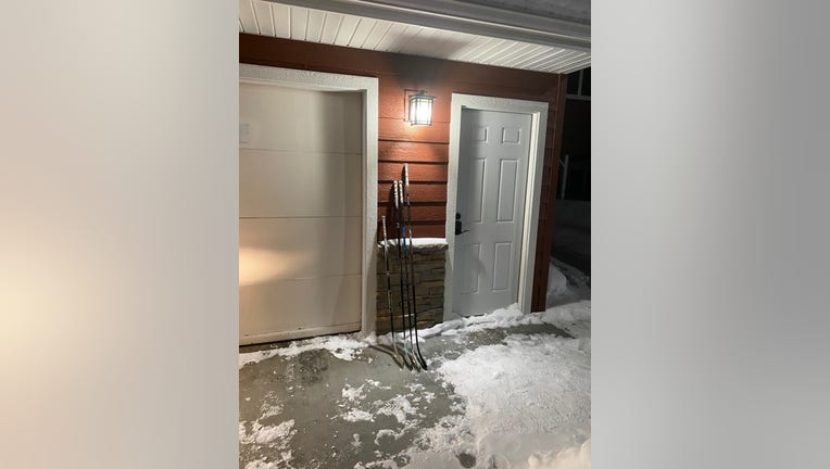 A family leaves hockey sticks outside the front door for #SticksOutForMarshall.