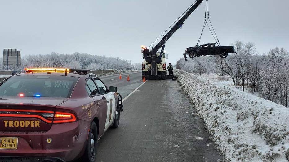 Pickup truck being removed from railroad tracks