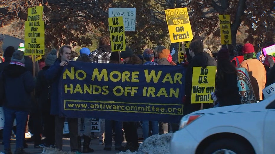 Protests hold banner saying