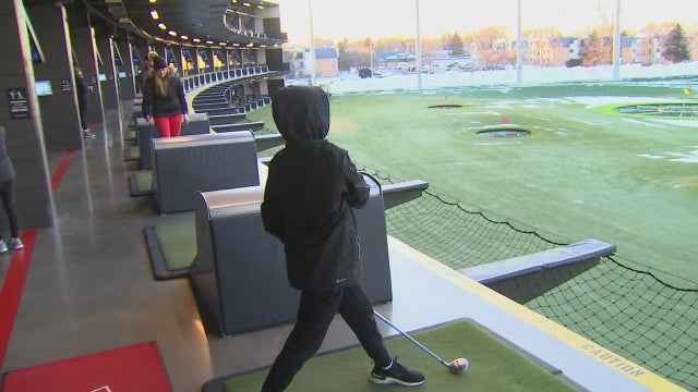 Golfers brave frigid weather to get swings in at Top Golf