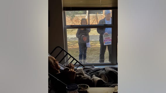 Minnesota family celebrates grandfather's 100th birthday through window