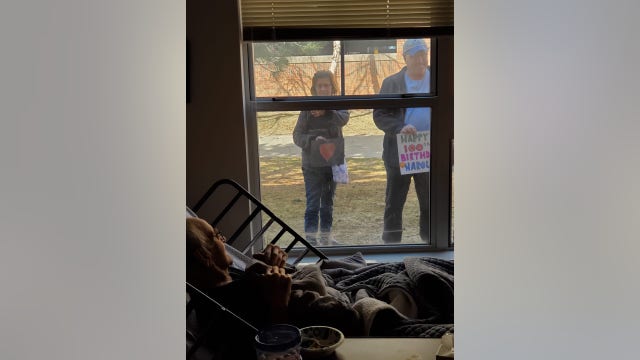 Minnesota family celebrates grandfather's 100th birthday through window
