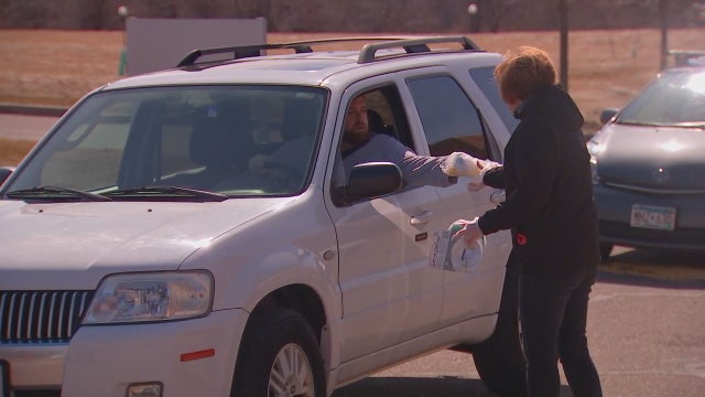 Cars line up to donate masks for Minnesota nurses as global demand for gear increases