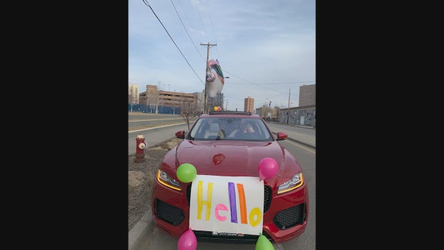 Stuck in isolation at hospital, supporters hold parade for Minnesota girl fighting cancer