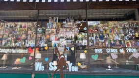 Downtown Osceola store fills window front with photos of graduating seniors