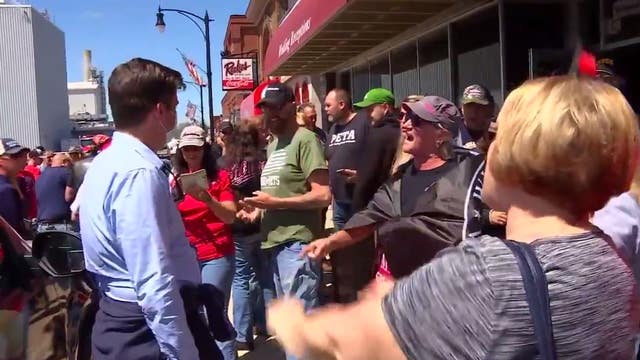 Reporter harassed for wearing mask while covering rally outside Minnesota bar