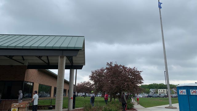 Minnesotans line up to receive free COVID-19 tests from the National Guard