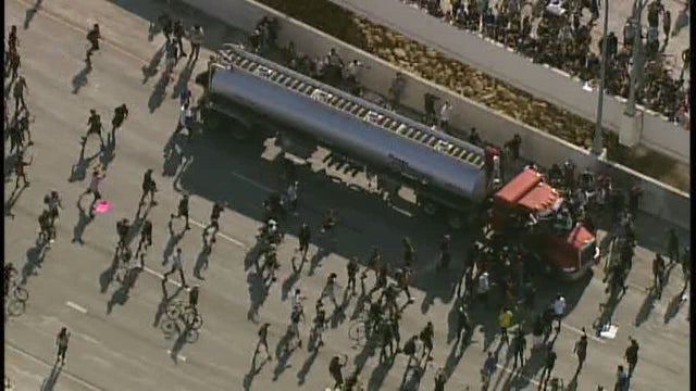 Semi driver who drove onto I-35W bridge during protest charged