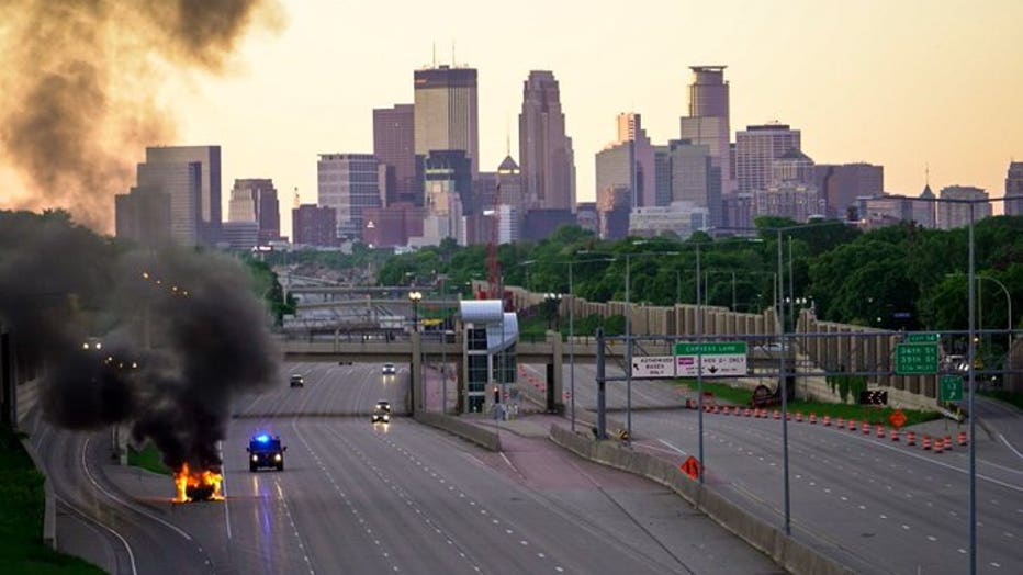 Car fire on a curfew-cleared Interstate 35W