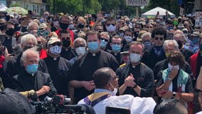 Protesters join Minneapolis clergy for silent march, prayer at George Floyd memorial