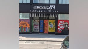 Artists paint murals honoring George Floyd on plywood protecting businesses around Minneapolis