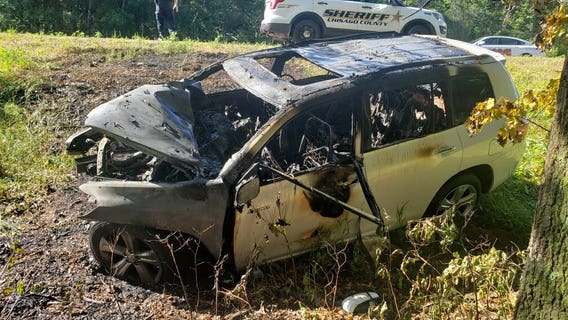 Bystanders rescue man from burning vehicle by using hammer to break window