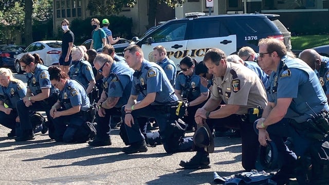 St. Paul Police officers seen kneeling in solidarity with protesters at Governor's Mansion