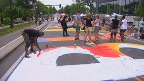 Artists create 'Black Lives Matter' mural along Plymouth Avenue in Minneapolis