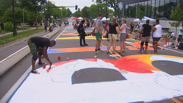 Artists create 'Black Lives Matter' mural along Plymouth Avenue in ...