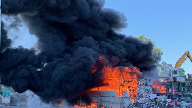 Fire burns in debris pile at recycling facility in St. Paul, Minnesota