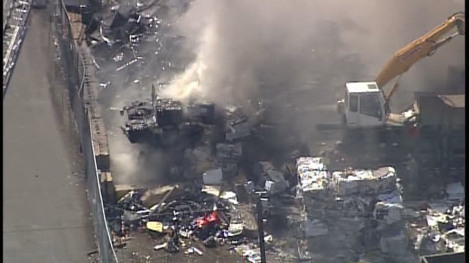 Fire burns in debris pile at recycling facility in St. Paul, Minnesota