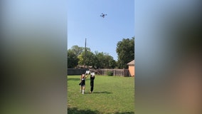 Couple tests socially-distanced Halloween candy delivery system using drone