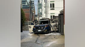 Man arrested after Seattle Police car set on fire with officer inside