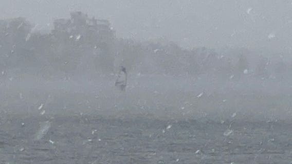 Video: Man seen windsurfing on Minneapolis lake during snowstorm