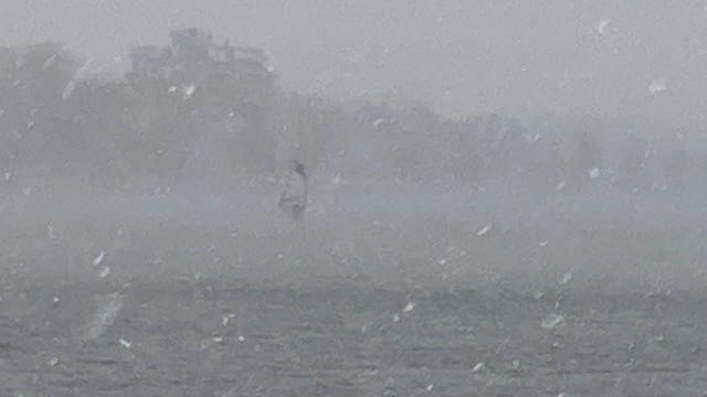 Video: Man seen windsurfing on Minneapolis lake during snowstorm