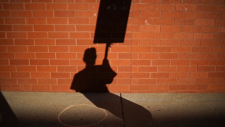shadow of nurse picketing