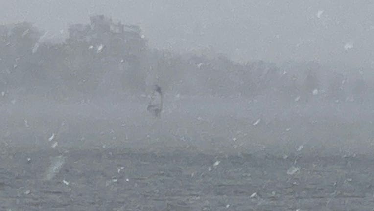 Windsurfer on Bde Maka Ska during snowstorm