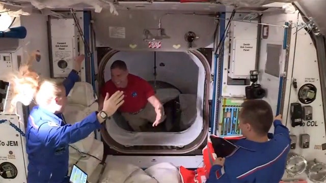 SpaceX capsule with 4 astronauts docks with space station