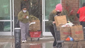 Last-minute shoppers in Minnesota trudge through snowstorm