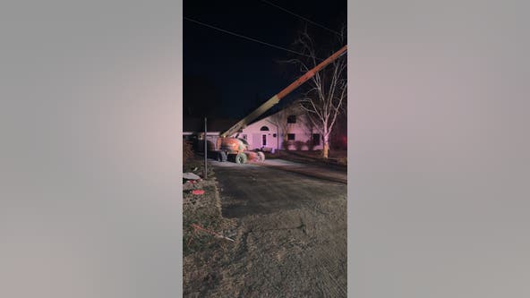 Aerial lift hits powerline, catches fire during Christmas tree decorating