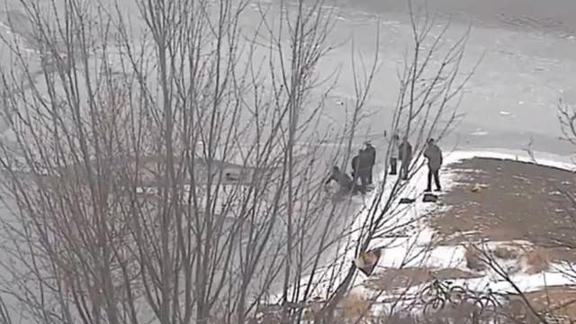 Video shows father, police officer save boy who fell through ice in Wisconsin