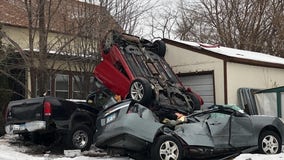 Car takes air, flips, lands on two parked vehicles in Minneapolis