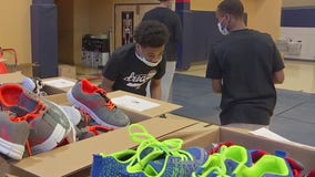 Local organizations team up to pack totes of shoes, toiletries, positive notes for Minneapolis youth