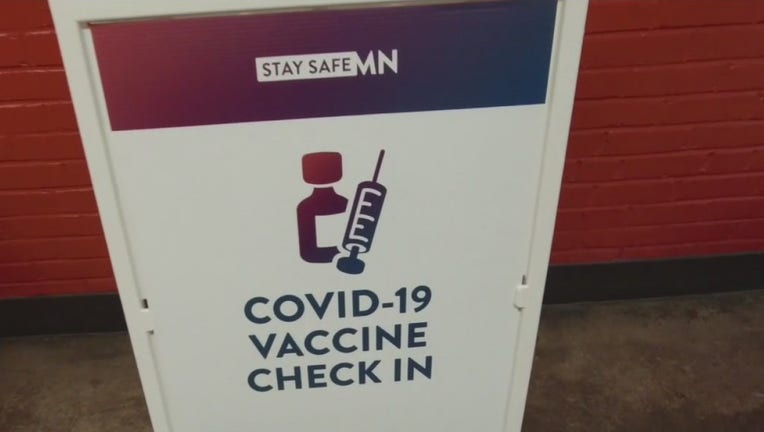 covid-19 vaccine check in sign