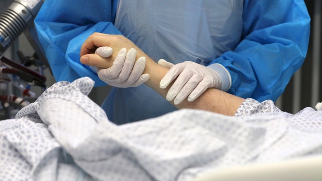 UK judge rules comatose woman with COVID-19 should be removed from life support weeks after giving birth