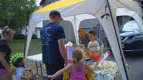 Boy holds lemonade stand to help support Farmington Police K-9