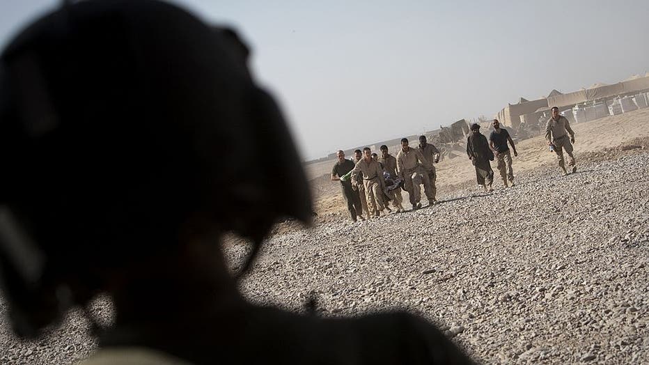 A US medevac personnel watches as US mar