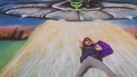 Chalk art photoshoot transports children with special needs into colorful scenes