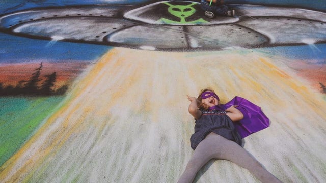 Chalk art photoshoot transports children with special needs into colorful scenes