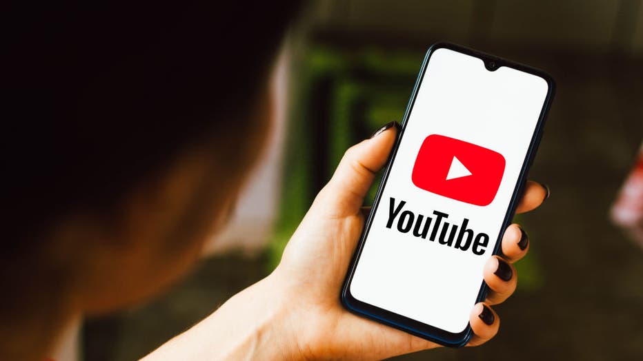 In this photo illustration the YouTube logo seen displayed