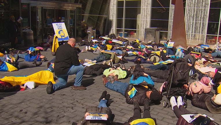 Ukrainian-Americans stage a "die-in" after a march from their community's central hub in Northeast Minneapolis to Nicollet Mall in downtown Minneapolis.
