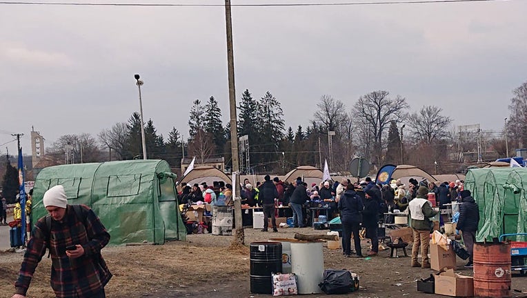 A border crossing in Poland where Ukrainian refugees are outside for hours prior to moving on to the reception center.