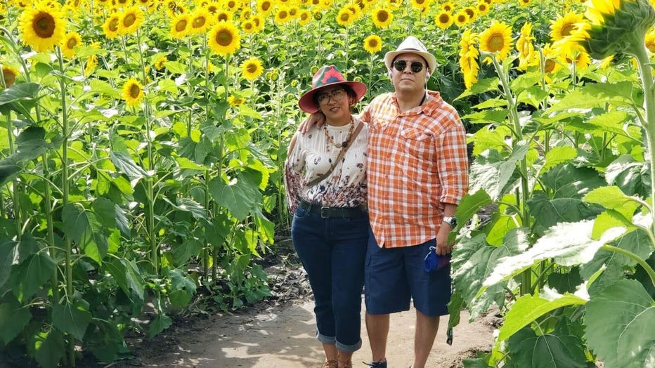 Miguel Abrego Hurtado and Concepcion Leticia Carrillo Arellano in a field of flowers.  (Image provided by family)