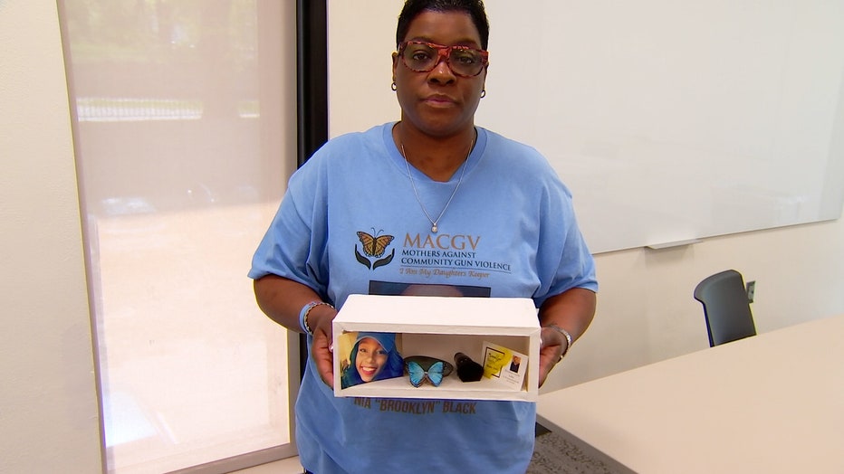 LaTanya Black holds a box of items representing her daughter, Nia Black.