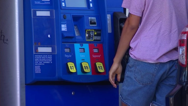 Man pays for gas at the pump
