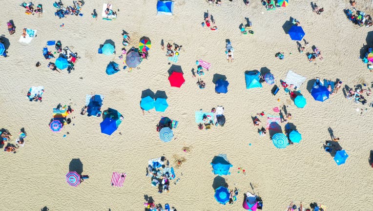 People enjoy warm weather at New Jersey beach